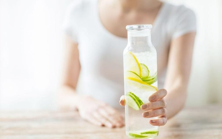 Healthy Filipino adult practicing balanced wellness habits with hydration, nutritious meals, and active lifestyle support